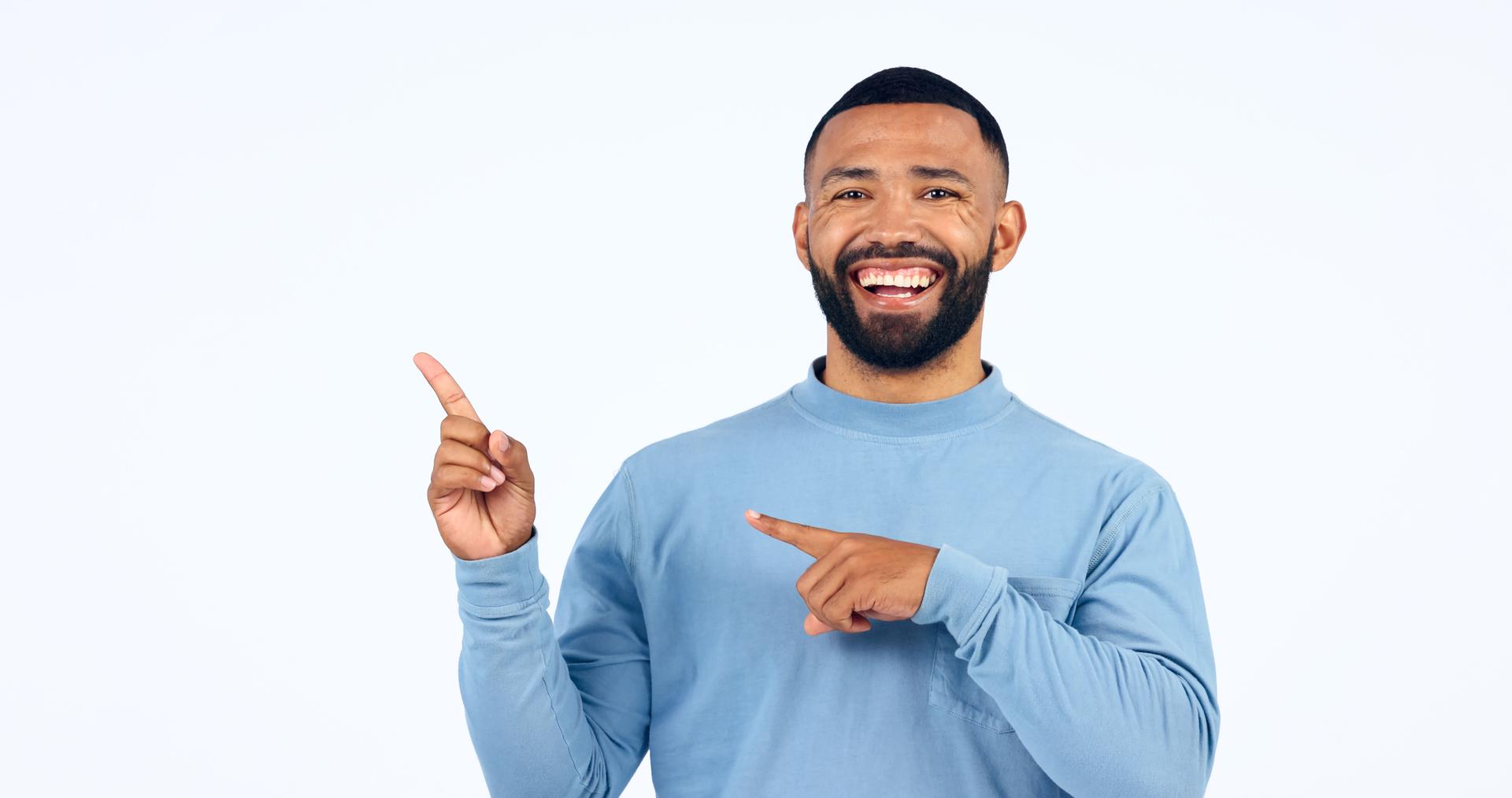 Man, portrait and pointing in studio for advertising information, deal or choice on white background. Happy model, presentation or show mockup space for feedback, promotion or launch of news about us